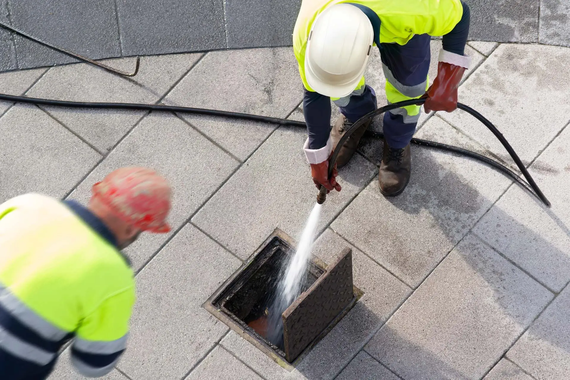 Plumber clearing same-day kitchen drain clog in busy Delray Beach home