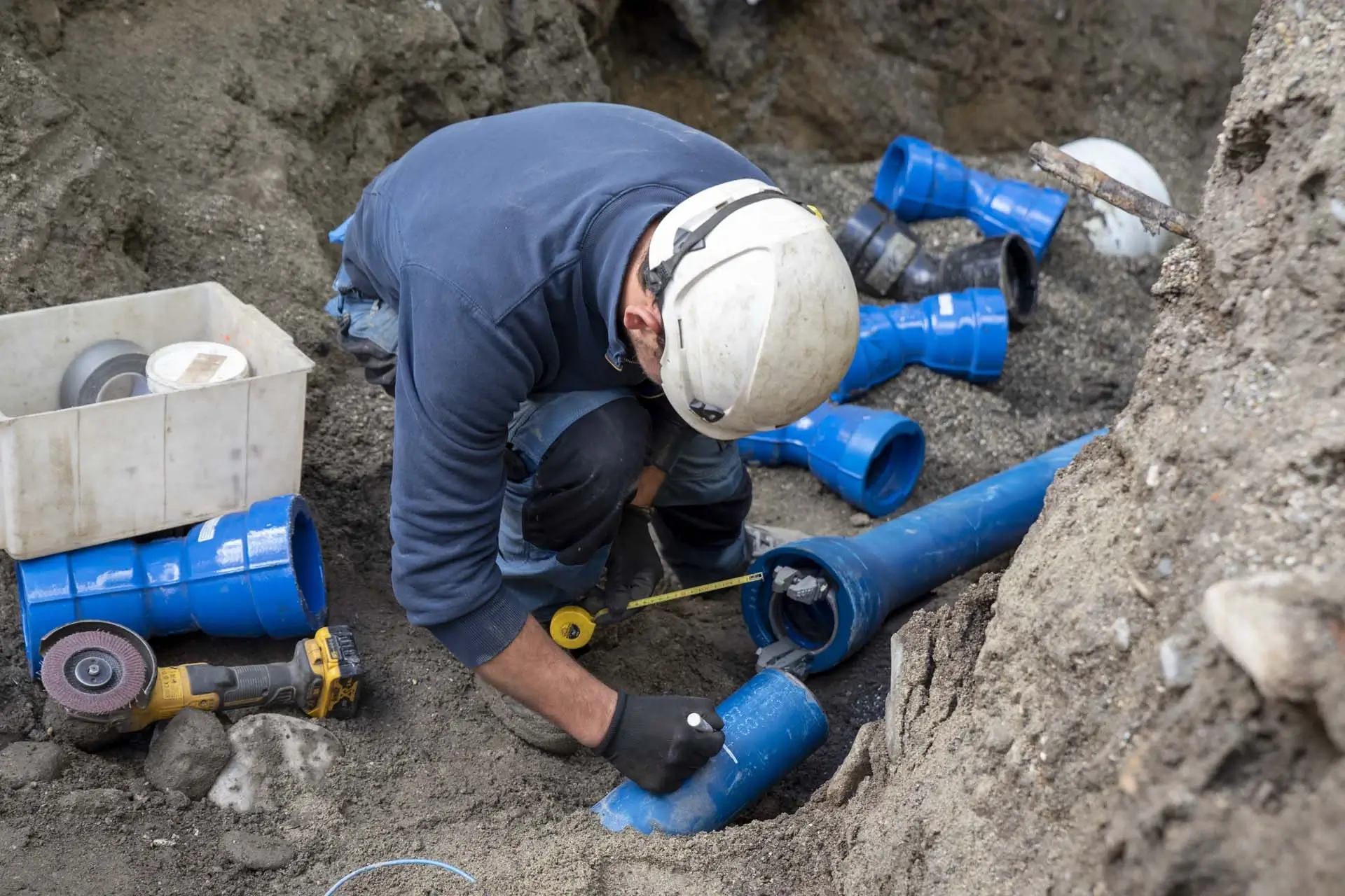 Outdoor water filtration system with pipes and a Nuvo filter housing.