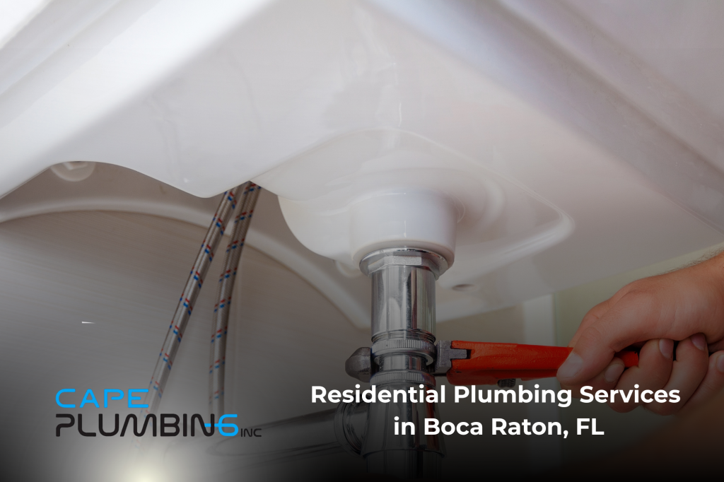 Residential plumbing services in Boca Raton, FL, showing a plumber using a wrench to work on a sink drain pipe beneath a bathroom sink, with Cape Plumbing Inc. branding